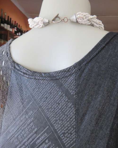 Sexy,shiny black long top with scooped neckline.Size 38/14.Circle panels in lace and poly.As new