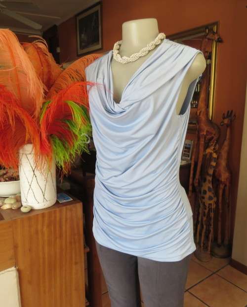 Stylish powder blue poly stretch top with soft flowing neckline and gathered sides by OASIS size 38