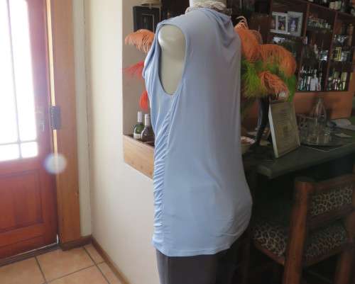 Stylish powder blue poly stretch top with soft flowing neckline and gathered sides by OASIS size 38