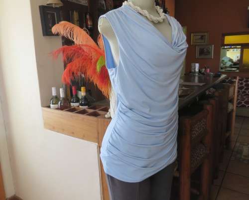 Stylish powder blue poly stretch top with soft flowing neckline and gathered sides by OASIS size 38