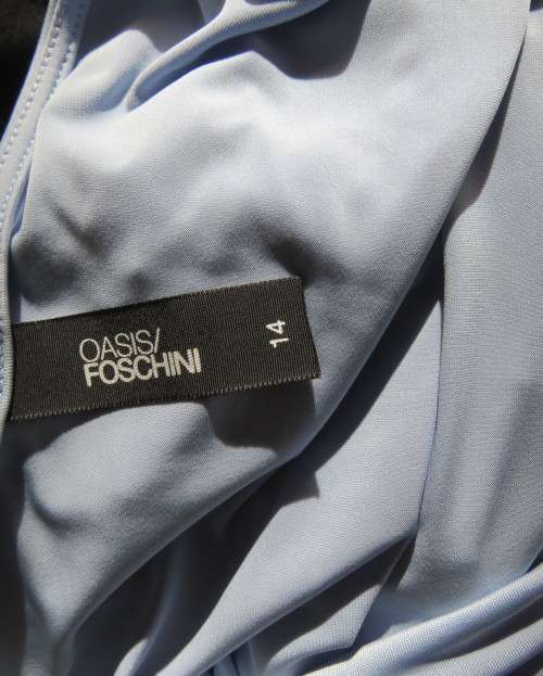 Stylish powder blue poly stretch top with soft flowing neckline and gathered sides by OASIS size 38