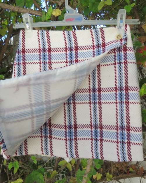 Stunning winters skort in cream tweed with blue/maroon check.Fold over with attached panties.Size 30