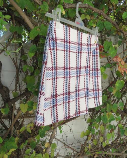 Stunning winters skort in cream tweed with blue/maroon check.Fold over with attached panties.Size 30