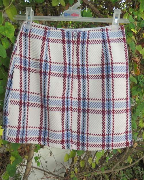 Stunning winters skort in cream tweed with blue/maroon check.Fold over with attached panties.Size 30