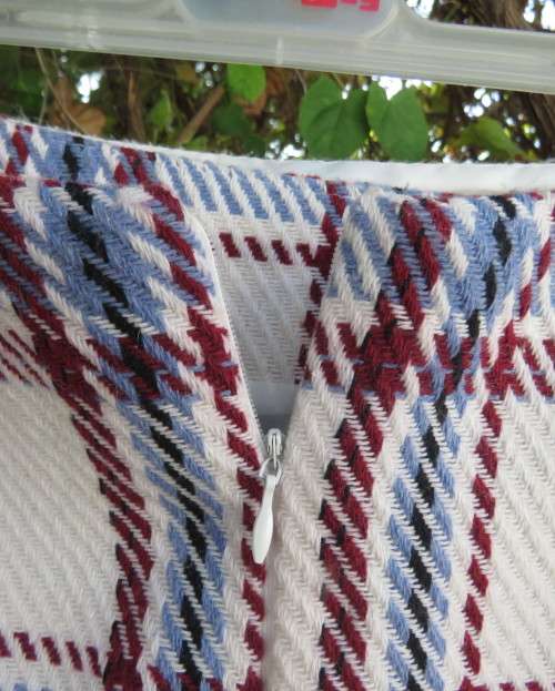 Stunning winters skort in cream tweed with blue/maroon check.Fold over with attached panties.Size 30