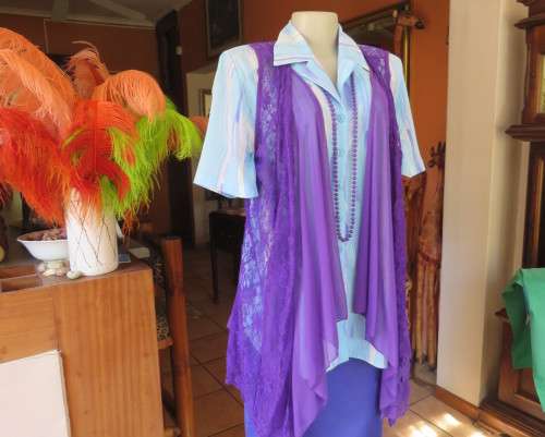 Girly purple acrylic lace gilet with netting front inlay. Frilled back seam.Size 36 to 38.As new