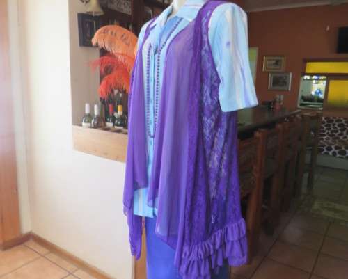Girly purple acrylic lace gilet with netting front inlay. Frilled back seam.Size 36 to 38.As new