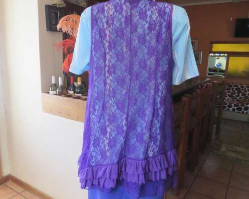 Girly purple acrylic lace gilet with netting front inlay. Frilled back seam.Size 36 to 38.As new