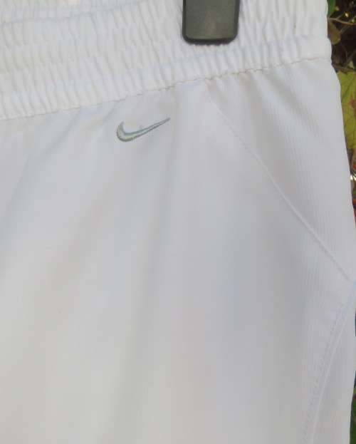 NIKE dri-fit white straight legged sport pants in 100% polyester with stretch netting inner,Size 36.