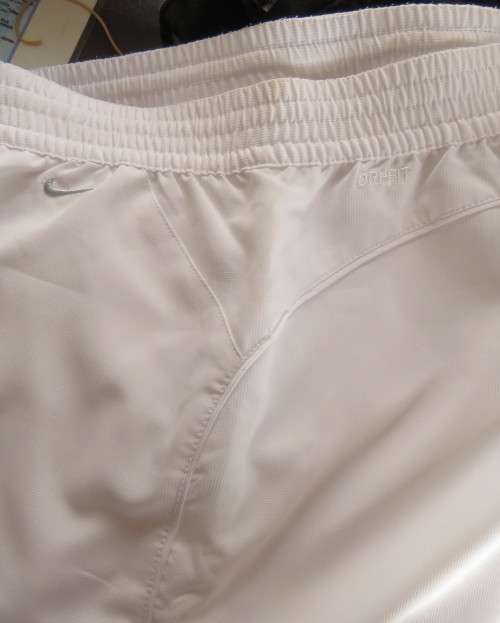 NIKE dri-fit white straight legged sport pants in 100% polyester with stretch netting inner,Size 36.