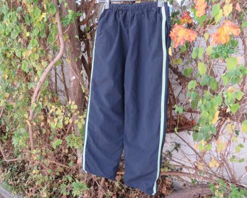 Men`s navy nylon track pants and poly stretch inner size 32 Elasticated waist.Mintgreen side stripes