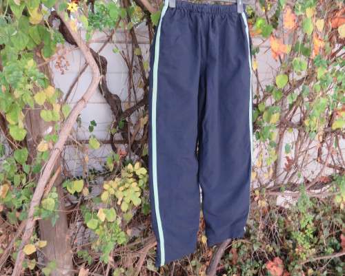 Men`s navy nylon track pants and poly stretch inner size 32 Elasticated waist.Mintgreen side stripes