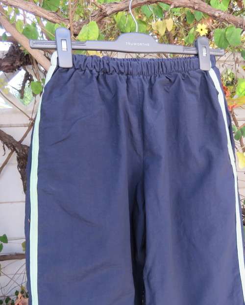 Men`s navy nylon track pants and poly stretch inner size 32 Elasticated waist.Mintgreen side stripes