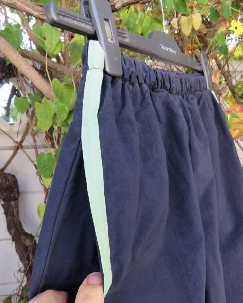 Men`s navy nylon track pants and poly stretch inner size 32 Elasticated waist.Mintgreen side stripes