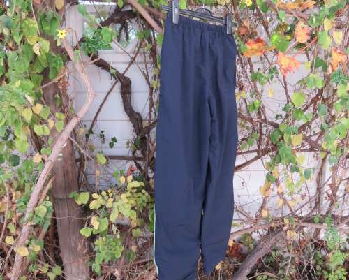 Men`s navy nylon track pants and poly stretch inner size 32 Elasticated waist.Mintgreen side stripes