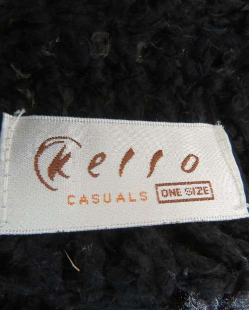 Black crochet lace stitch poncho in double knit acrylic yarn. Fringed. By KELSO.Best fit 32 to 36.