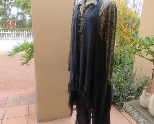 Handy extra long slate grey knitted 100% acrylic waterfall style gilet.Size 42 to 44.Fringed.As new