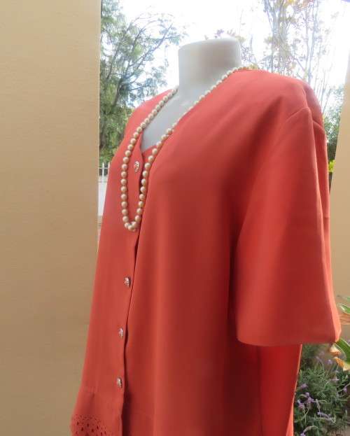 Make a statement in this button down burnt orange top/jacket by RHAPSODY size 44/20. New cond.