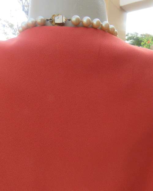 Make a statement in this button down burnt orange top/jacket by RHAPSODY size 44/20. New cond.