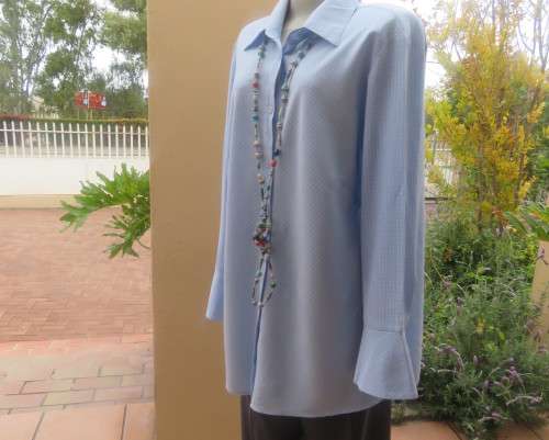 Beautiful slightly creased blue/white small check long sleeve button down top.Size 44/20.As new