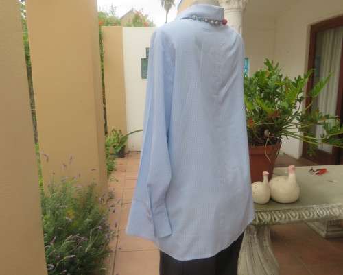 Beautiful slightly creased blue/white small check long sleeve button down top.Size 44/20.As new