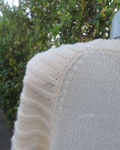 Stunning extra long soft cream acrylic knit long raglan sleeve slip over cardigan. Size 42/18.As new