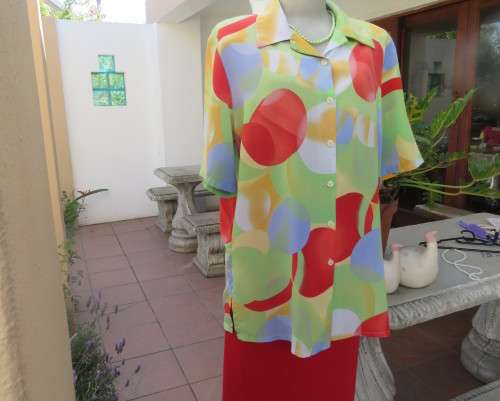 Striking colourful red/blue/yellow/green graphic print button down top.By IN CLOTHING size 42.As new