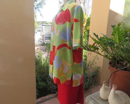 Striking colourful red/blue/yellow/green graphic print button down top.By IN CLOTHING size 42.As new