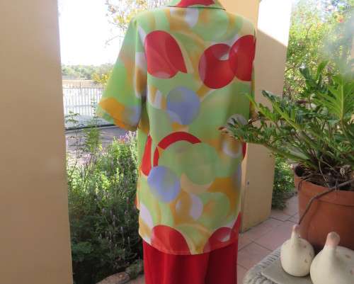 Striking colourful red/blue/yellow/green graphic print button down top.By IN CLOTHING size 42.As new