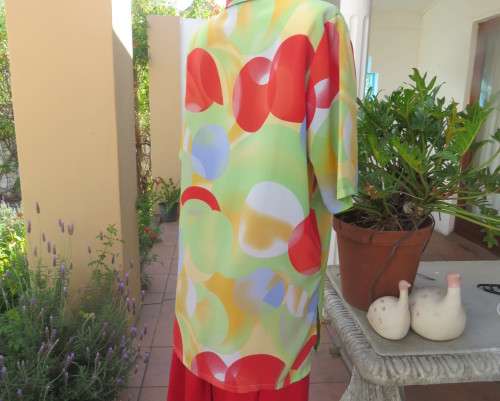 Striking colourful red/blue/yellow/green graphic print button down top.By IN CLOTHING size 42.As new