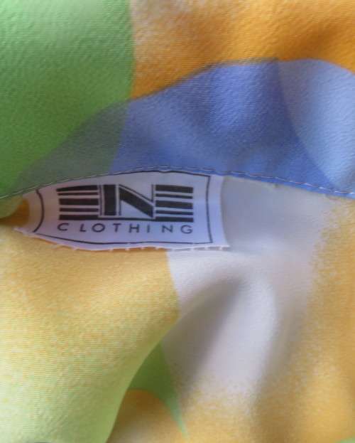 Striking colourful red/blue/yellow/green graphic print button down top.By IN CLOTHING size 42.As new