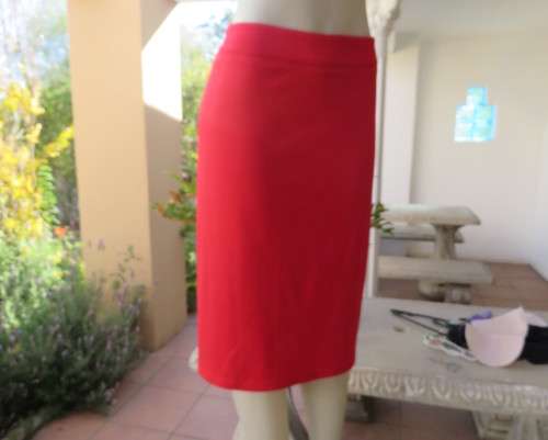 Smart red pencil skirt in red jersey fabric with some stretch.Size 42/18. Pleat at back. As new.
