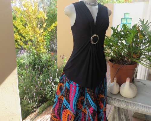 Sexy black viscose stretch sleeveless top with ruched front with buckle. IDENTITY size 38/14.As new