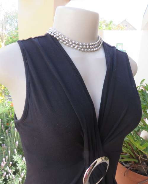 Sexy black viscose stretch sleeveless top with ruched front with buckle. IDENTITY size 38/14.As new