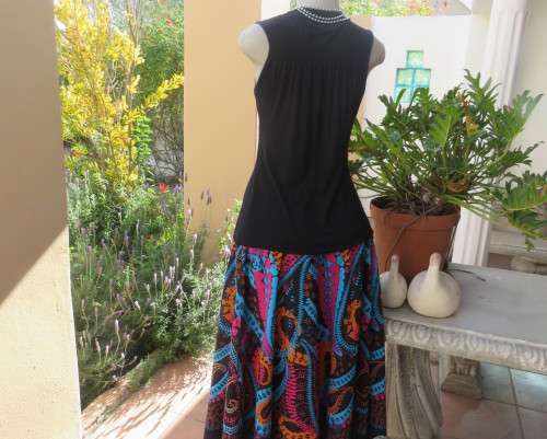 Sexy black viscose stretch sleeveless top with ruched front with buckle. IDENTITY size 38/14.As new