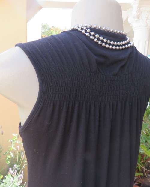 Sexy black viscose stretch sleeveless top with ruched front with buckle. IDENTITY size 38/14.As new