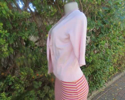 Charming champagne pink acrylic/nylon/cotton knitted button down cardigan.By TAKE OUT size 36/12.