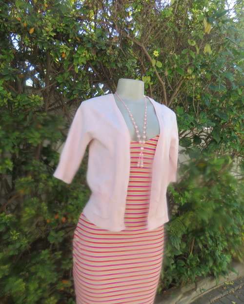 Charming champagne pink acrylic/nylon/cotton knitted button down cardigan.By TAKE OUT size 36/12.