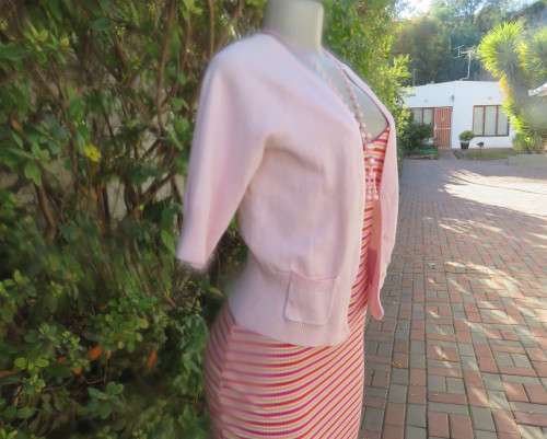 Charming champagne pink acrylic/nylon/cotton knitted button down cardigan.By TAKE OUT size 36/12.