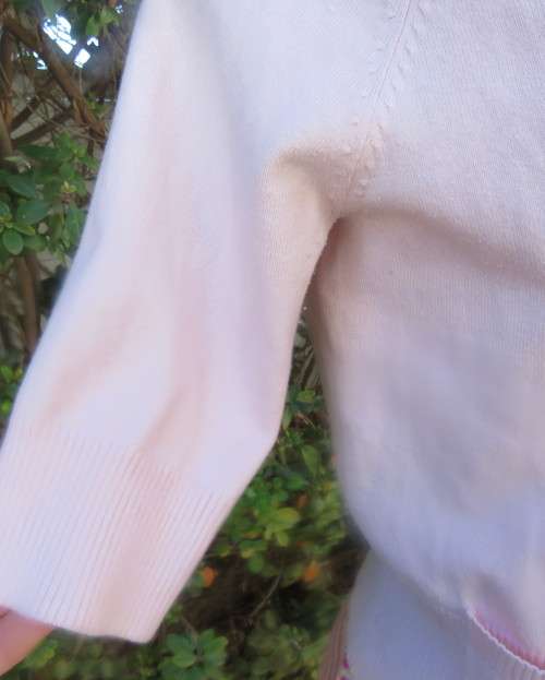 Charming champagne pink acrylic/nylon/cotton knitted button down cardigan.By TAKE OUT size 36/12.