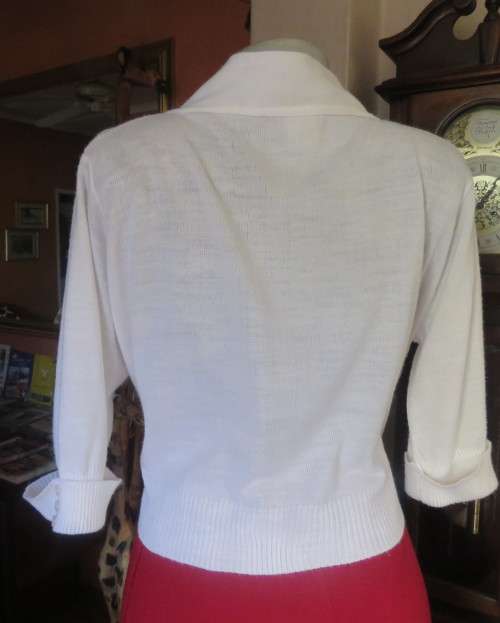 Simply classic acrylic knit cover up white top/jacket with elbow length sleeves.Size 42/18, As new