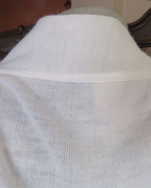 Simply classic acrylic knit cover up white top/jacket with elbow length sleeves.Size 42/18, As new