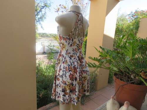 Cute white summer dress with autumn colour flowers. Halter neck with 6 thin straps at back.Size 32/8