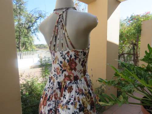 Cute white summer dress with autumn colour flowers. Halter neck with 6 thin straps at back.Size 32/8