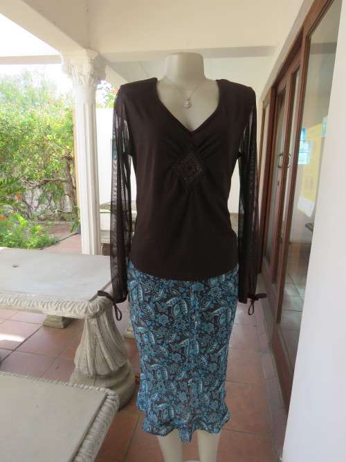 Choc brown stretch viscose slip over top.See through long sleeves.V neck.Diamond shape decor.Size 38