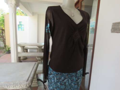 Choc brown stretch viscose slip over top.See through long sleeves.V neck.Diamond shape decor.Size 38