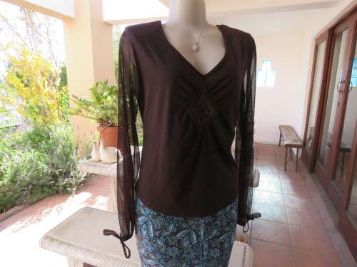 Choc brown stretch viscose slip over top.See through long sleeves.V neck.Diamond shape decor.Size 38