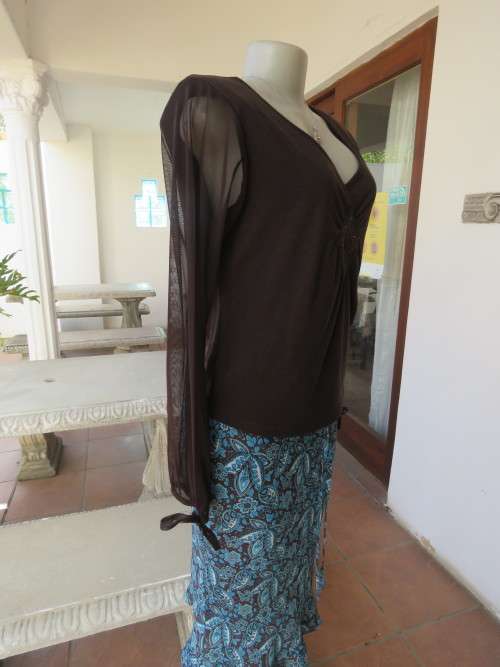 Choc brown stretch viscose slip over top.See through long sleeves.V neck.Diamond shape decor.Size 38