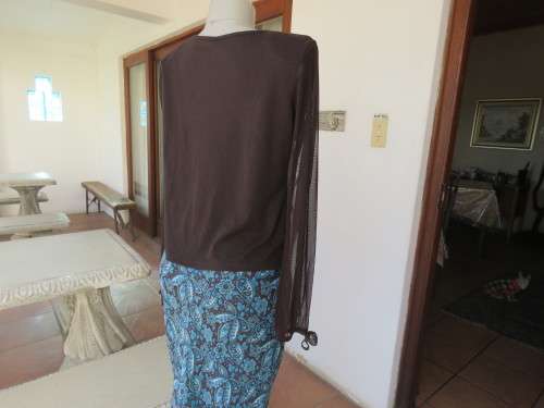 Choc brown stretch viscose slip over top.See through long sleeves.V neck.Diamond shape decor.Size 38