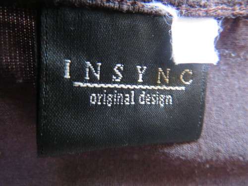 Choc brown stretch viscose slip over top.See through long sleeves.V neck.Diamond shape decor.Size 38